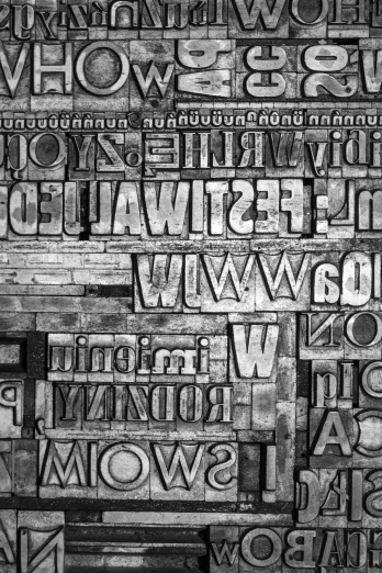 black and white pograph of letters stacked on each other