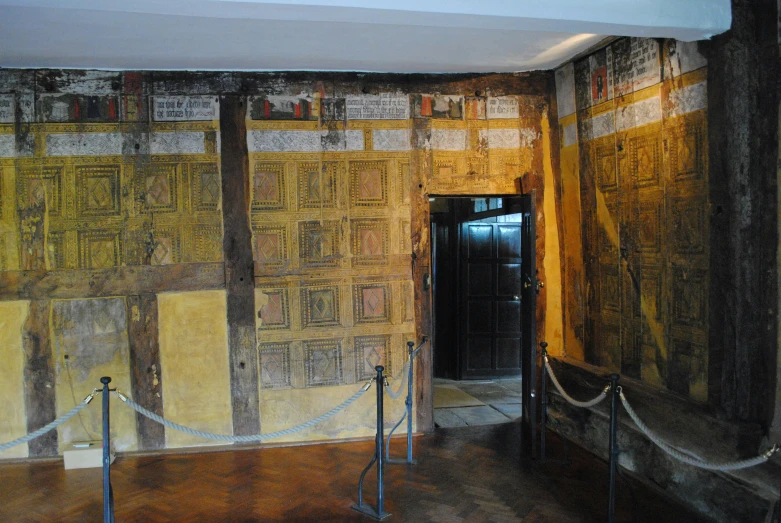 a room with yellow and brown designs painted on the walls