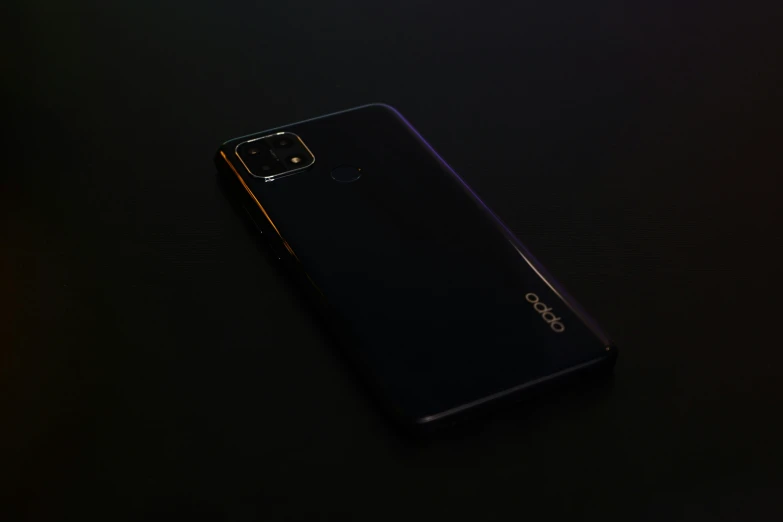 an angled image of a purple oppo phone on a dark surface