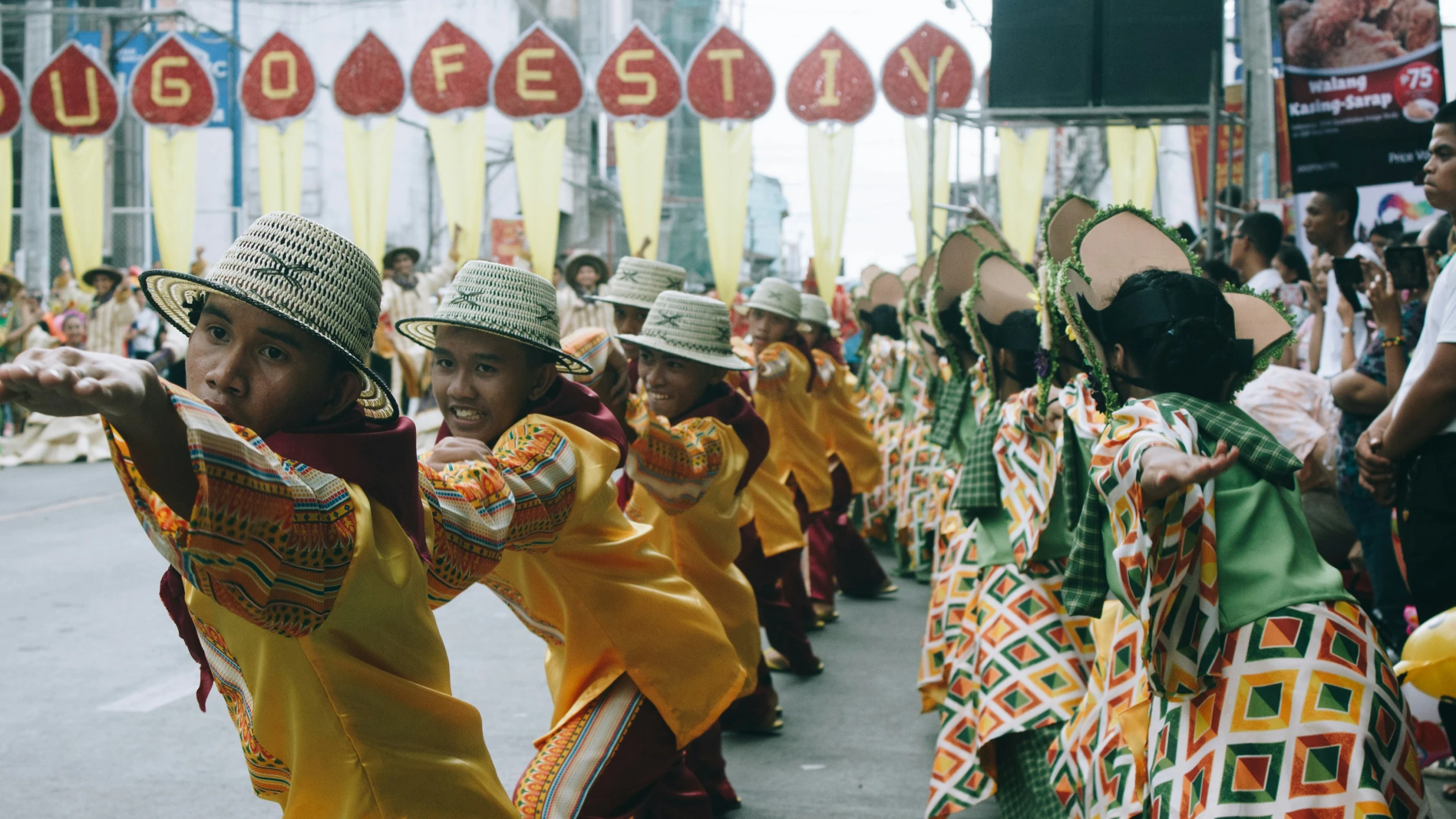 a parade of people with hats on doing different things