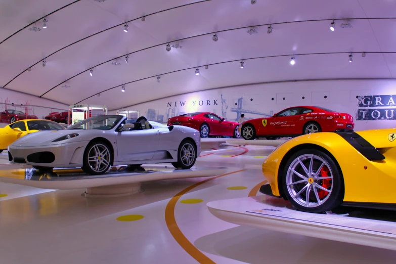 a number of different sports cars on display