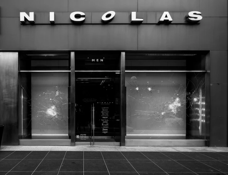 the storefront of a building that says, nicolelas