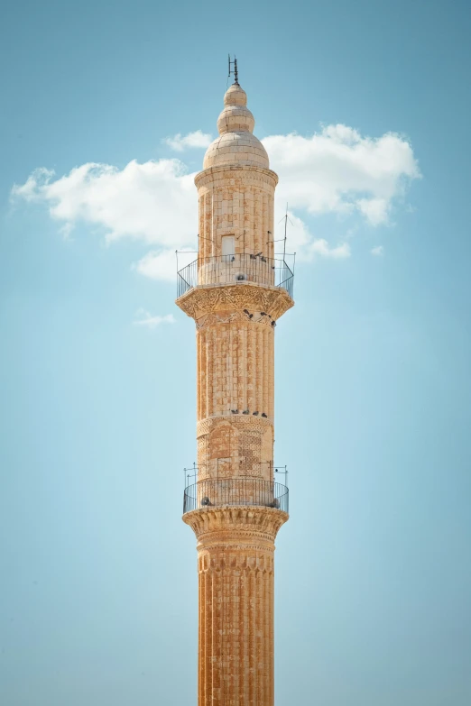 a tall tower with a balcony that sits at the top of it