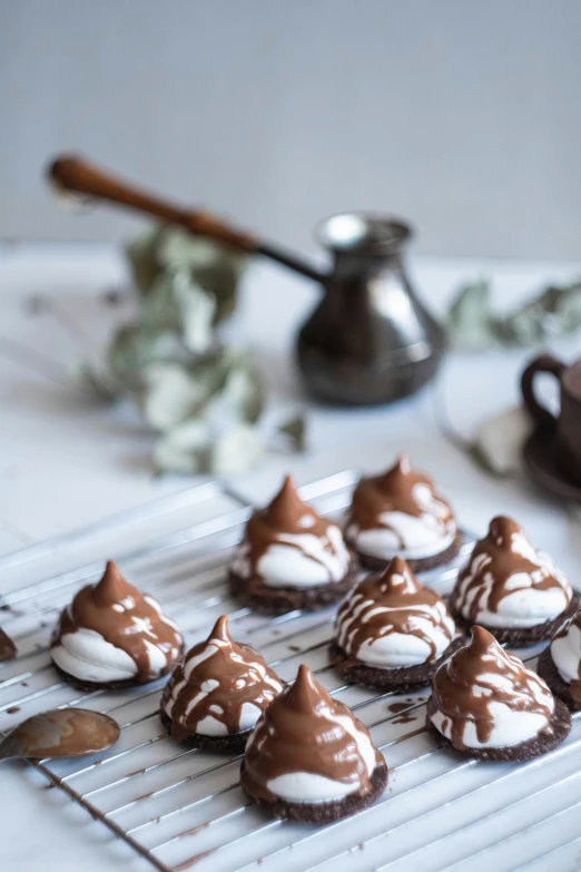 six small pastries are on a cooling rack