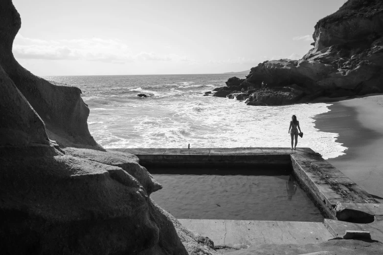 a person that is standing near the water