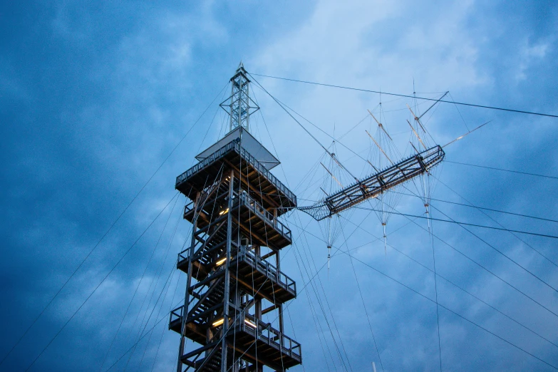 a cellular tower with a sky background