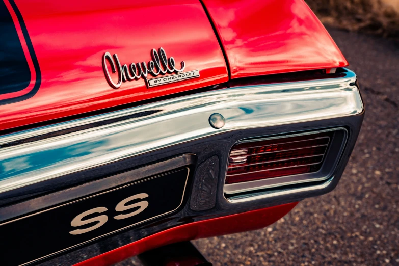 the tail end of a red sports car