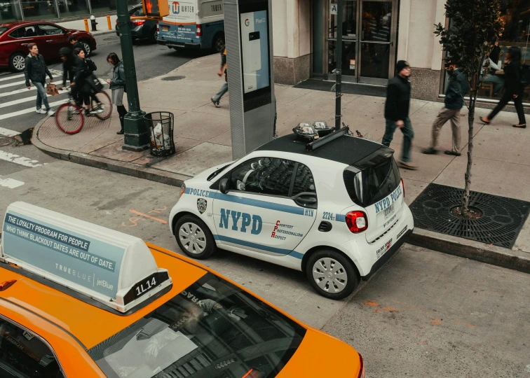 a city police car is driving down the street