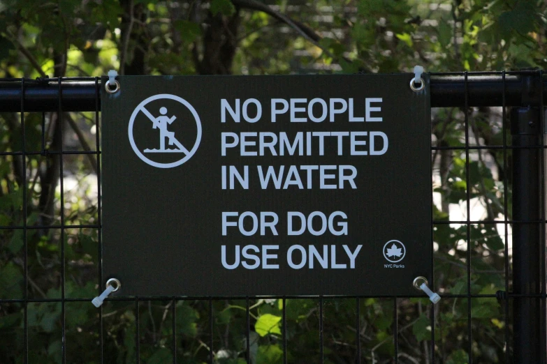 a sign indicating people that they are in the water