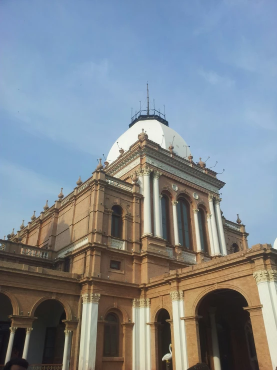 a large church with a round white roof