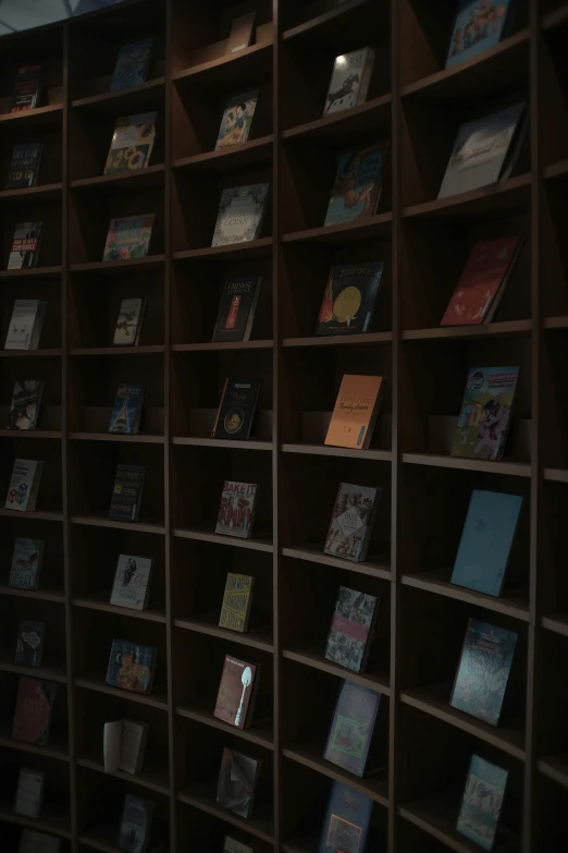 a bunch of books are placed on a bookcase