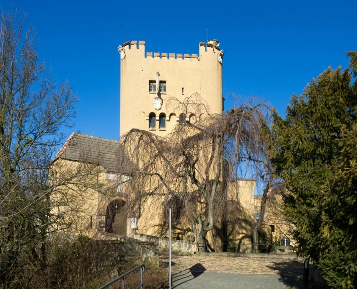 a tall castle with a clock on the tower