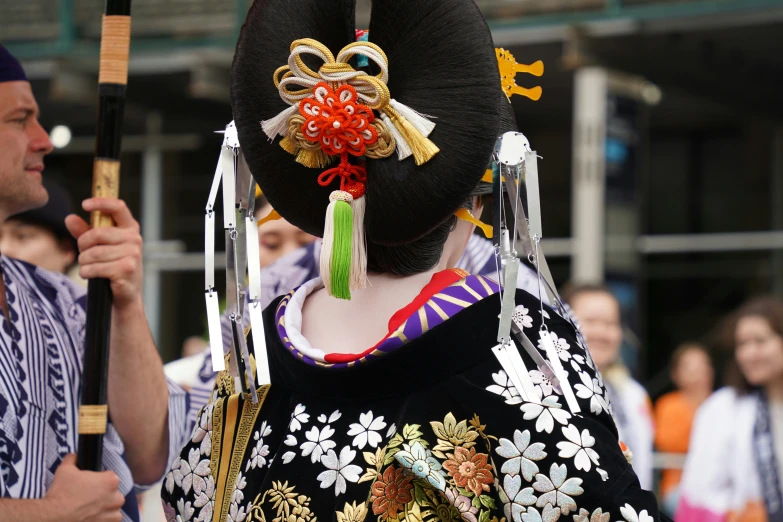 a woman with a black hat and oriental hair