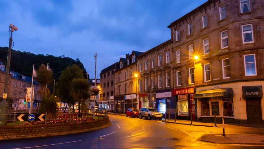 street with lamp post lights and buildings on both sides