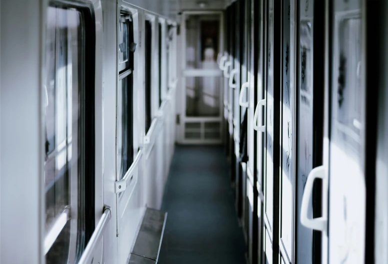 empty train carriage interior with two rows of windows