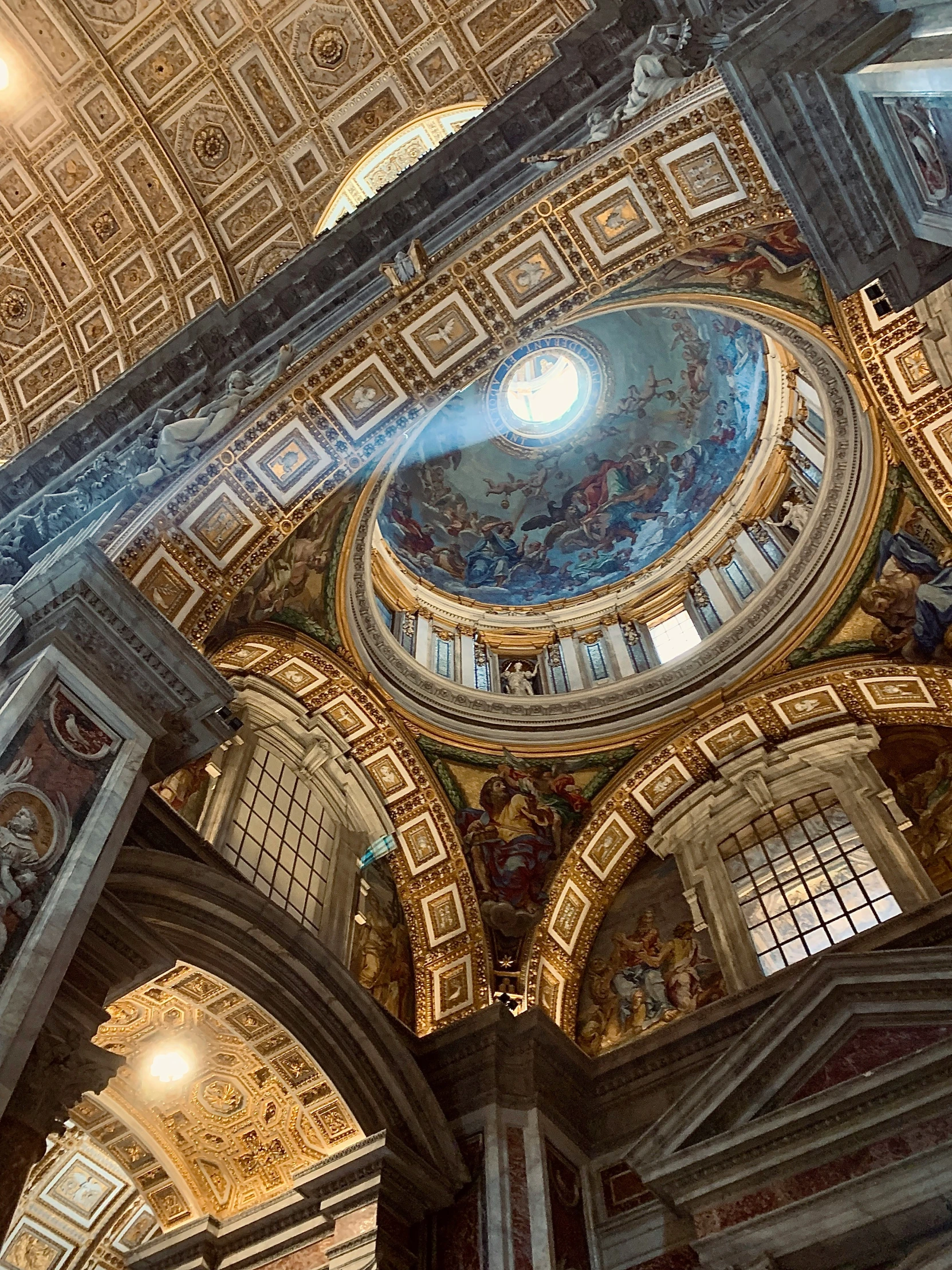 a dome ceiling with some paintings on the walls