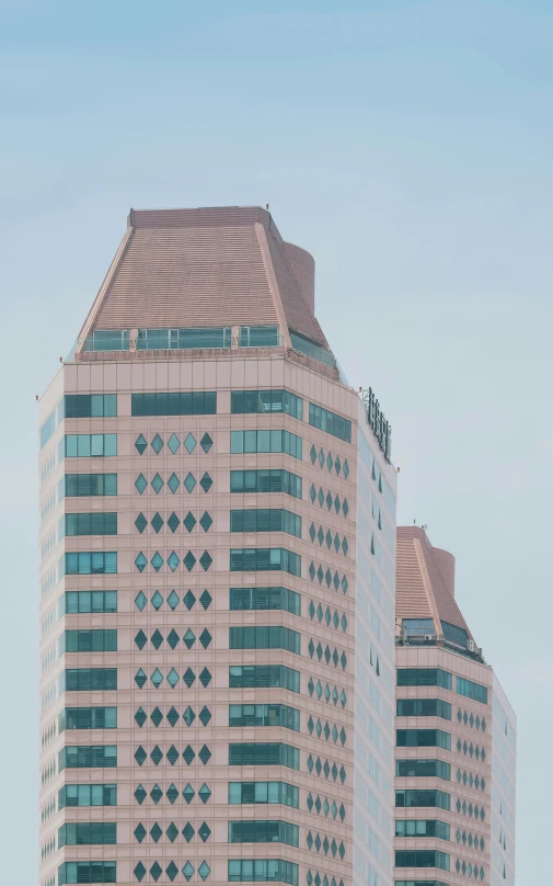 two buildings next to each other with one plane in the air