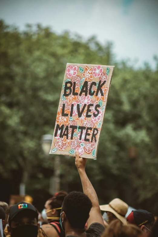 a group of people holding signs in a line