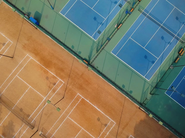 an overhead view of a tennis court, including the courts