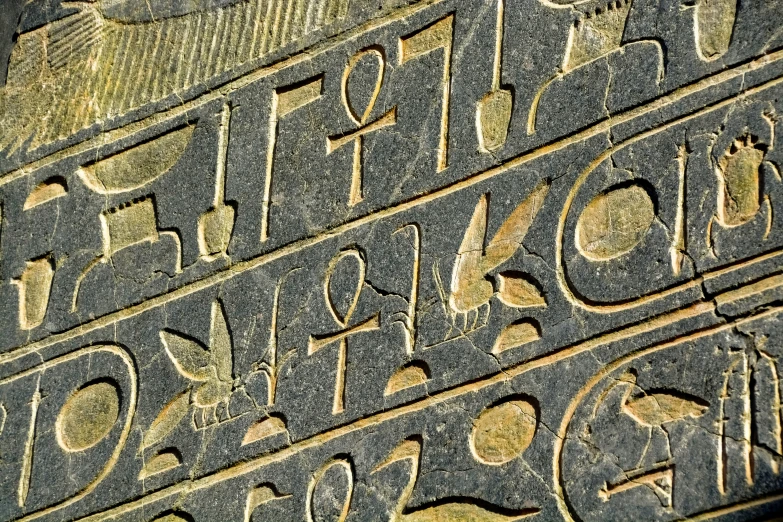some black and yellow letters and numbers on the side of a building