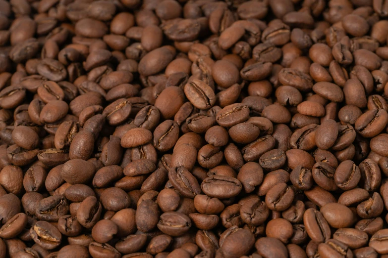 a pile of coffee beans are sitting on a table