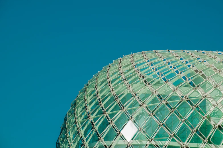 green structure with sky in the background