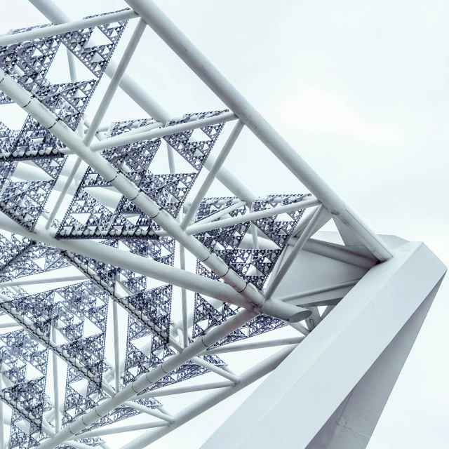 a po of a metal structure against a cloudy sky