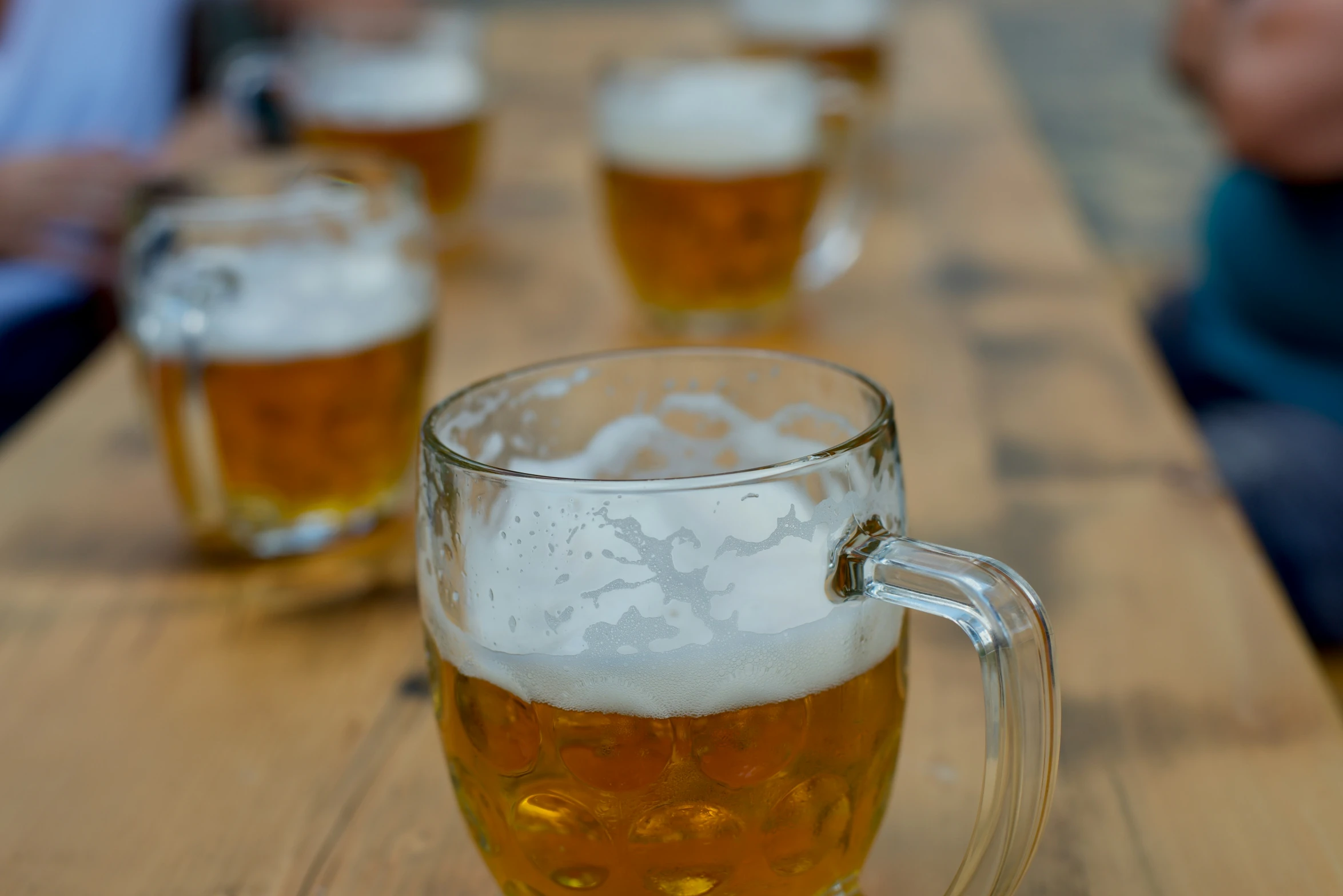 a large glass cup filled with liquid on top of a table