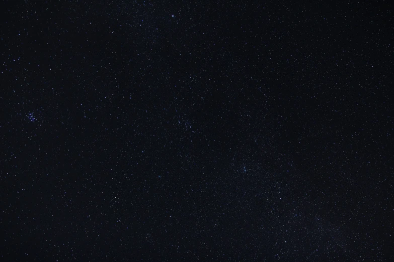 the night sky filled with stars and an airplane is seen in the foreground