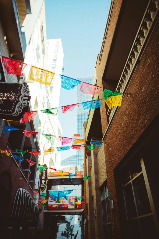 an image of a street that has flags on it