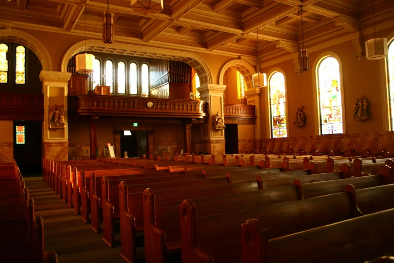 a couple of rows of chairs are in a church