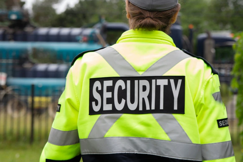 a security worker standing by some grass