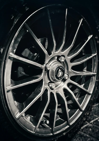 the wheel and tire of a car are pictured in this pograph