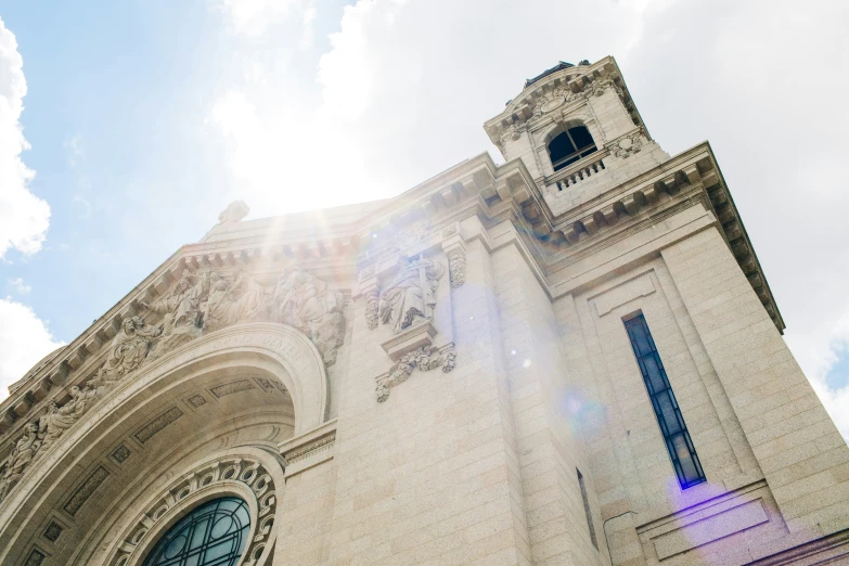 the sun shines brightly on an old white building