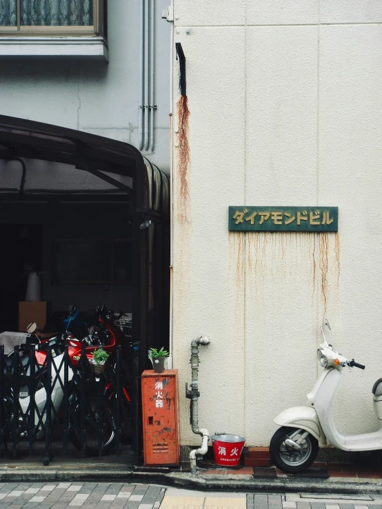 a motor scooter parked in front of a building