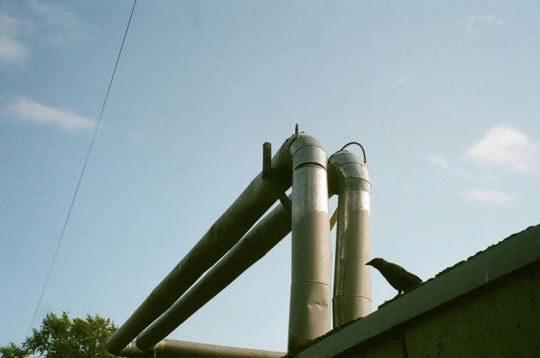 some pipes that are sitting against the side of a building