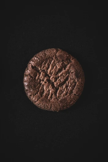 a chocolate cookie sitting on top of a table