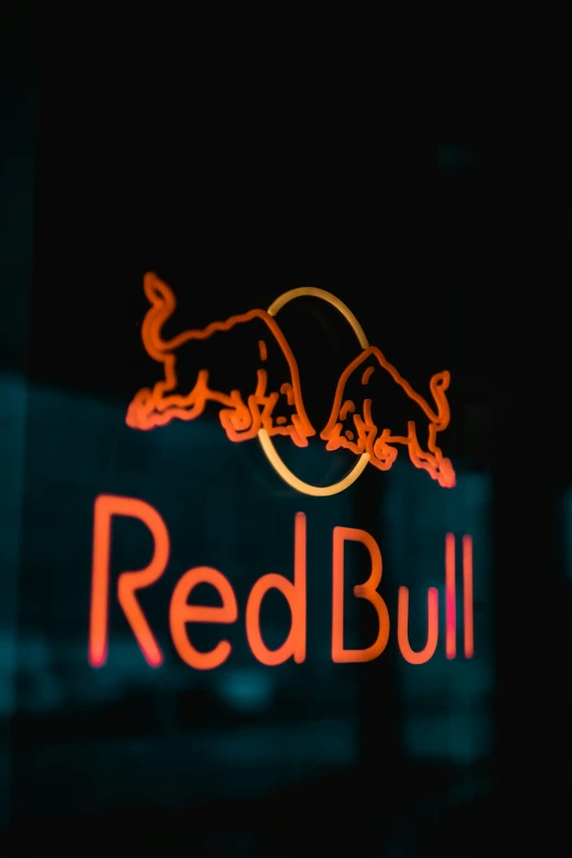 a red bull sign is shown against the dark background