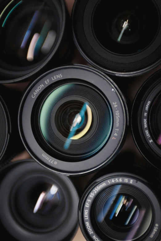 a group of multi - colored lens looking up at the sky