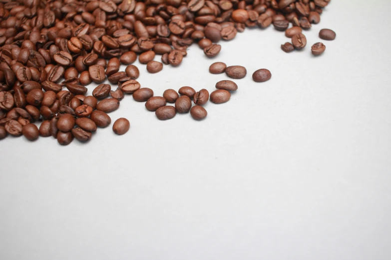 a pile of coffee beans sitting on top of a table