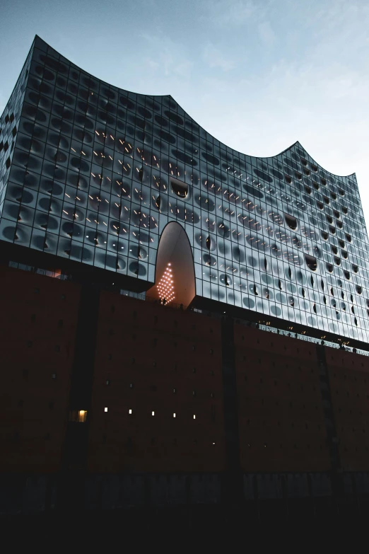 the side of an industrial building with reflective reflections on it