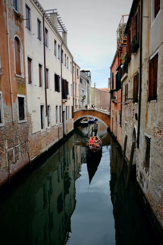 the view down a canal with two gondolas on each side