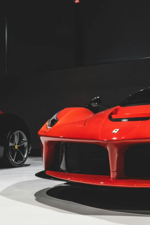 two red sports cars are sitting side by side