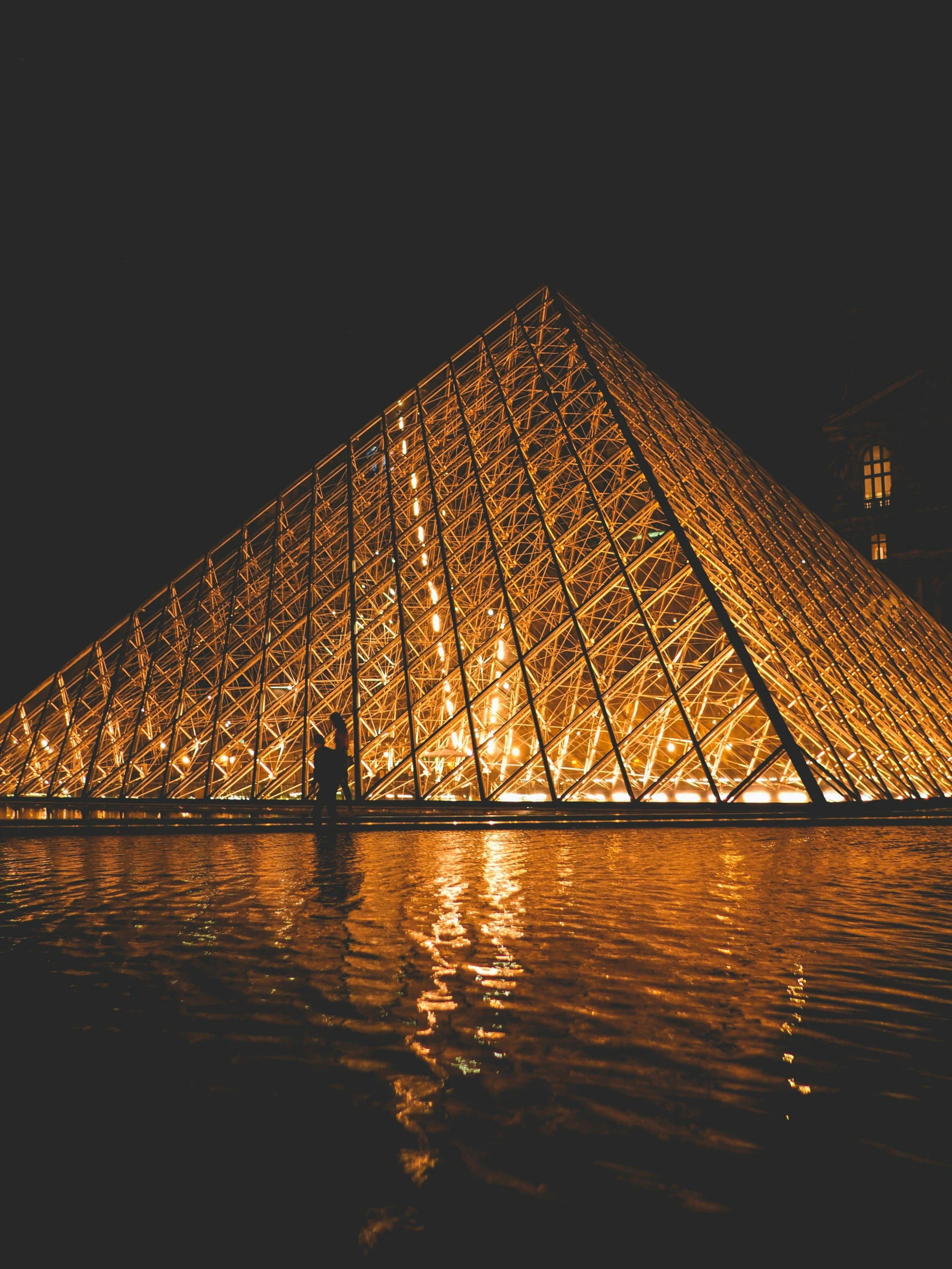 the pyramid has lights all around it