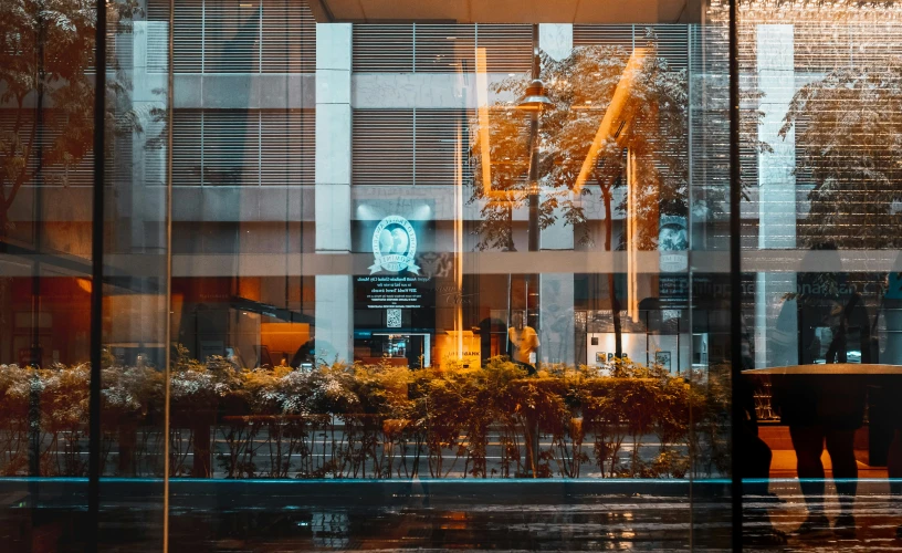 the reflection of an office building in the window