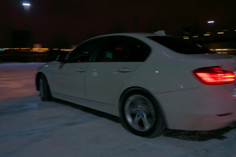 a car parked on a city street at night