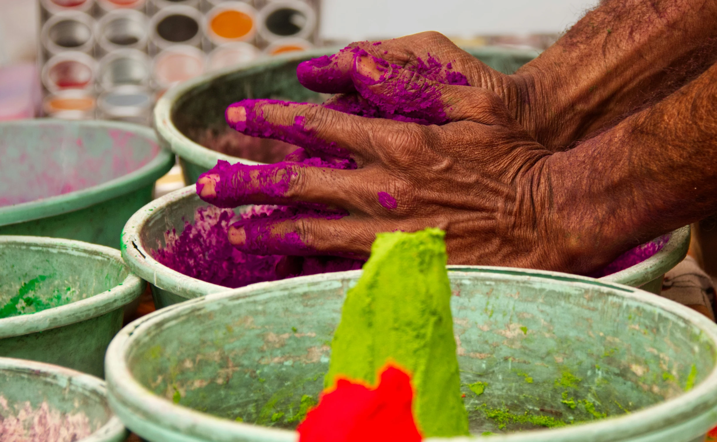 a person has their hands on some dirt