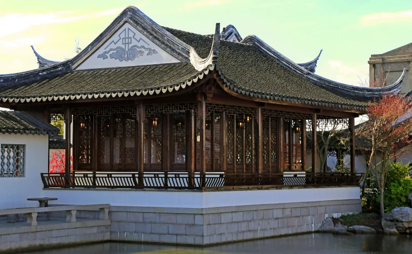 an ornate building surrounded by trees and other plants