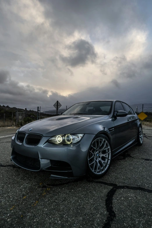 a grey car parked on top of a parking lot