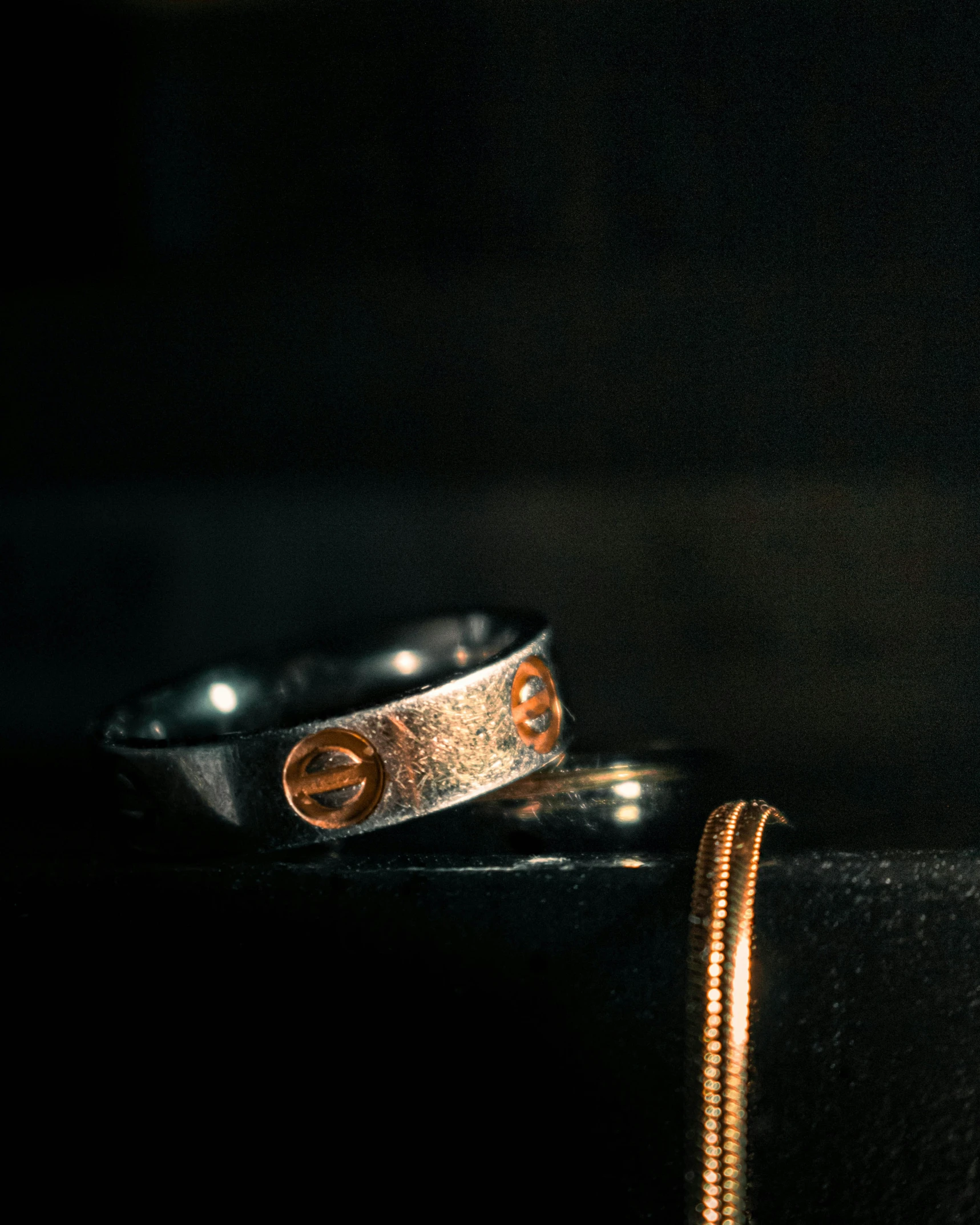 two rings sit on top of each other in the dark